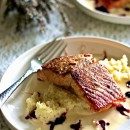 Grilled Salmon over couscous on a plate with Blackberry chipotle sauce