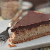 A slice of lentil cheesecake with chocolate ganache