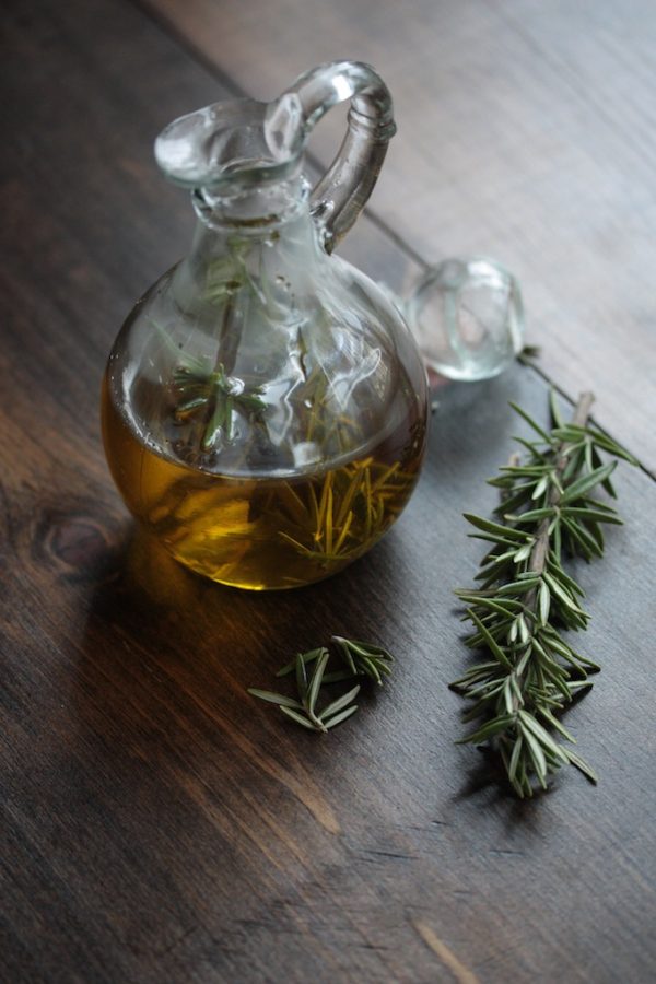 How to Infuse Olive Oil - in a glass jar with rosemary sprigs