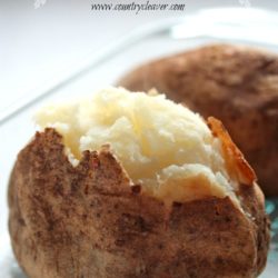 How to Bake the Perfect Potato in a glass dish against a white background