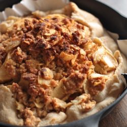 Close-up view of Apple Cherry Galette with Kettle Chip Crumble in a skillet