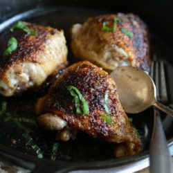 Overhead view of Crispy Chicken Thighs in a skillet