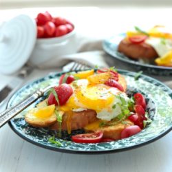 Breakfast Egg Crostini with tomatoes on a plate