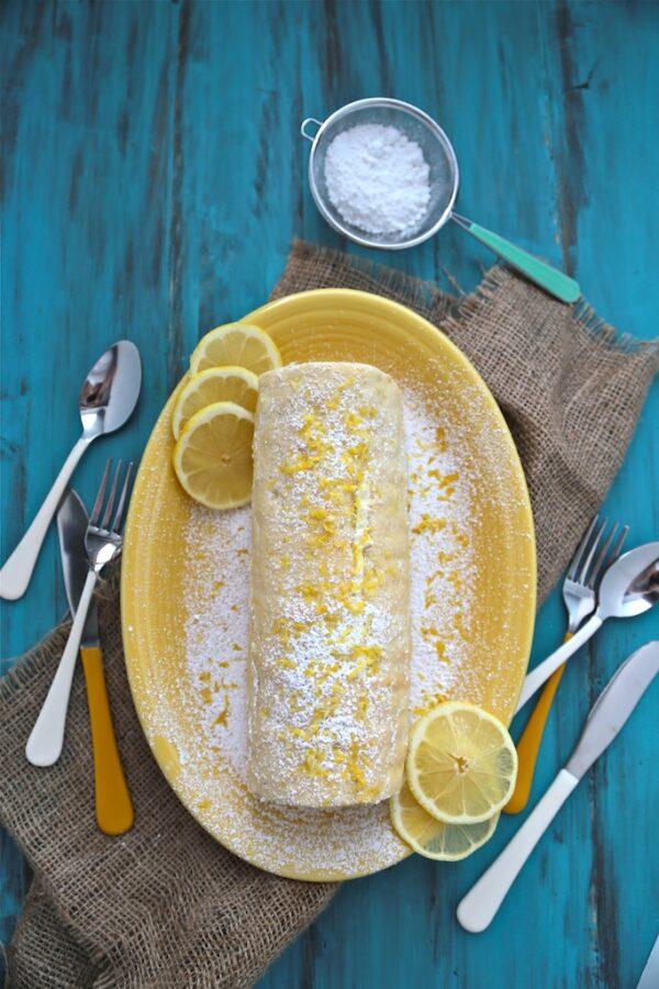 Lemon Roll Cake - www.countrycleaver.com This may look hard, but it's SUPER EASY to do!! You will love it! #lemon