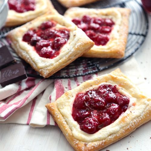 Quick and Easy Cherry Cream Cheese Danishes - www.countrycleaver.com on a white background and red and white napkin