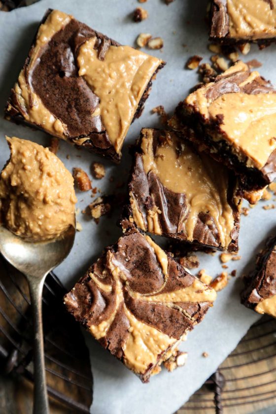 Chocolate Peanut Butter Brownies with Pretzel Crust - The ultimate brownie with swirled peanut butter and a sweet and salty pretzel crust! This easy dessert recipe will have you eating them out of the pan! 