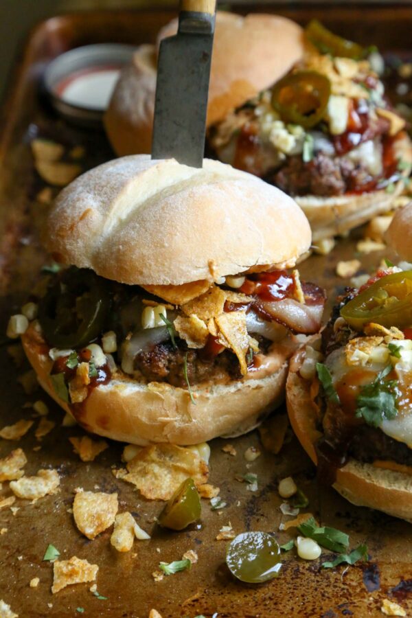 Southwest BBQ Bacon Burger - with crispy bacon, grilled corn, cowboy candied jalapenos, and jalapeno chips 