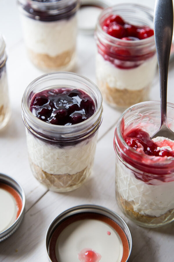 No Bake Cheesecakes In A Jar with blueberries and cherries