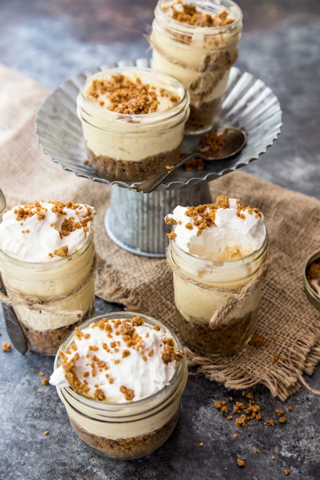 No Bake Pumpkin Cheesecakes on a board and on cake stand