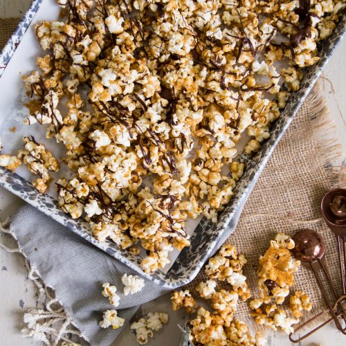 Pumpkin Spice Moose Munch in a small bucket and sheet pan