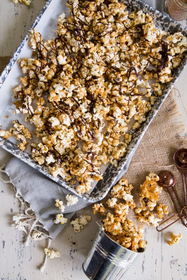 Pumpkin Spice Moose Munch in a small bucket and sheet pan
