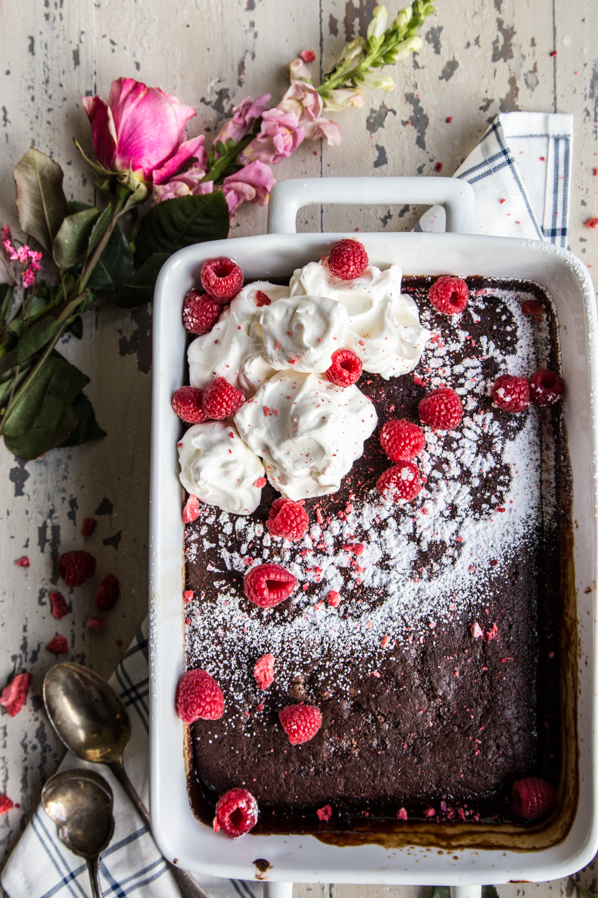 Chocolate Raspberry Espresso Pudding Cake with roses and raspberries