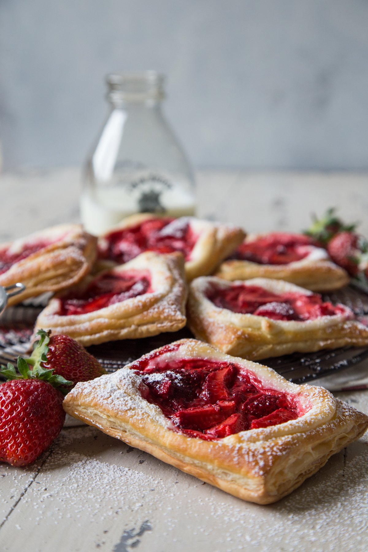 Fresh strawberry and cream cheese danishes sprinkled with powdered sugar