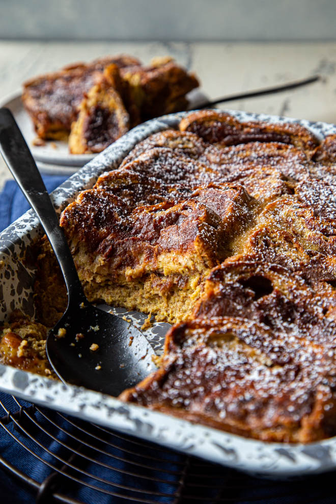 Baked french toast in a gray and white speckled dish